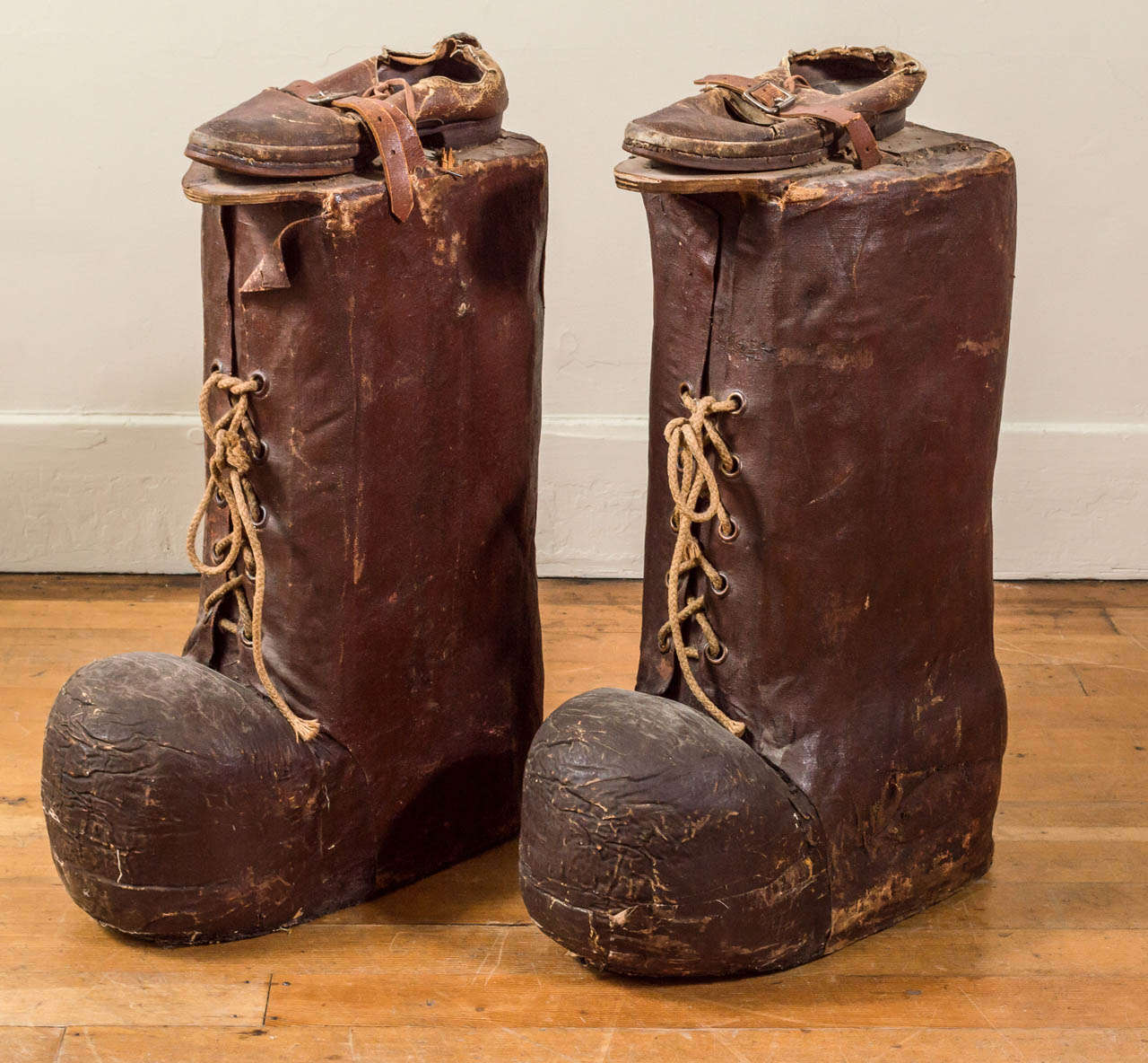 A vintage folksy pair of carnival /circus lumberjack style boots as found. looks to once have wood poles for navigating