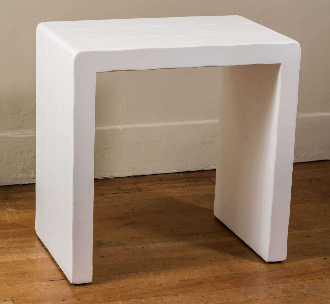 A Dickinson matte white finished grooved hollow wood table from The Sonoma Mission Inn