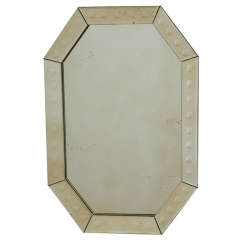 A SMALL VENETIAN STYLE MIRROR A SMALL VENETIAN STYLE MIRROR