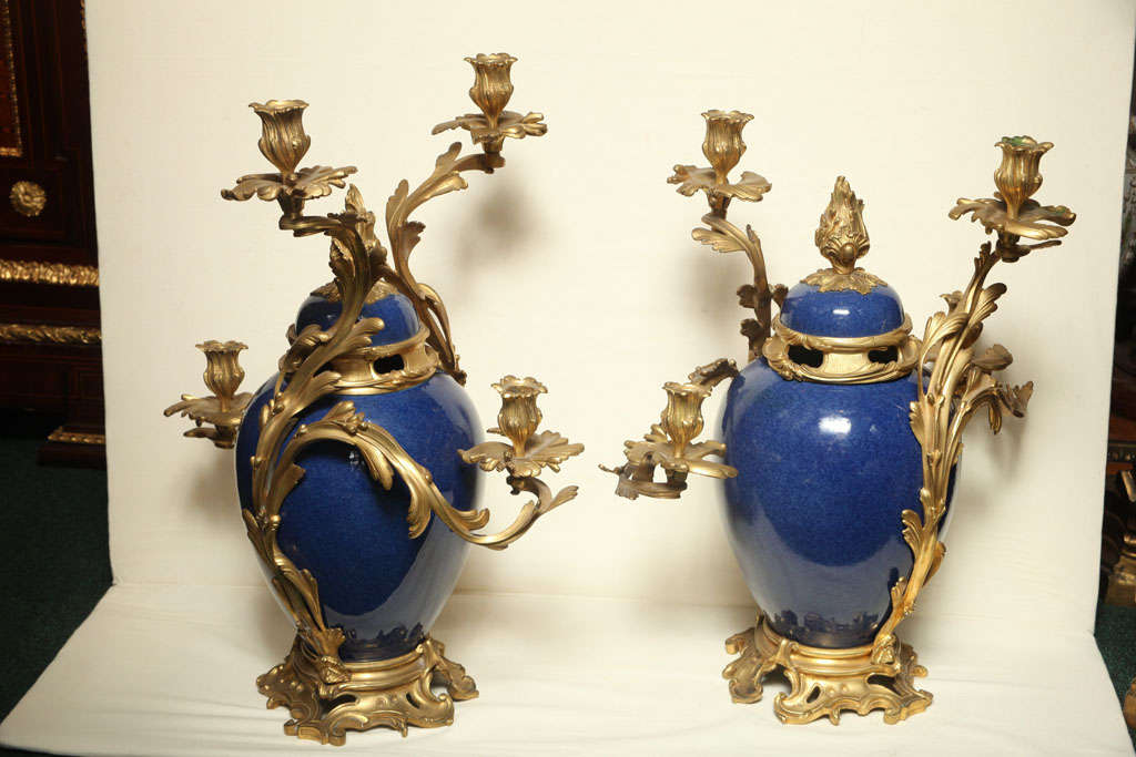 A pair of French four armed porcelain and bronze Louis XV style candelabras.
Stock number: L55.