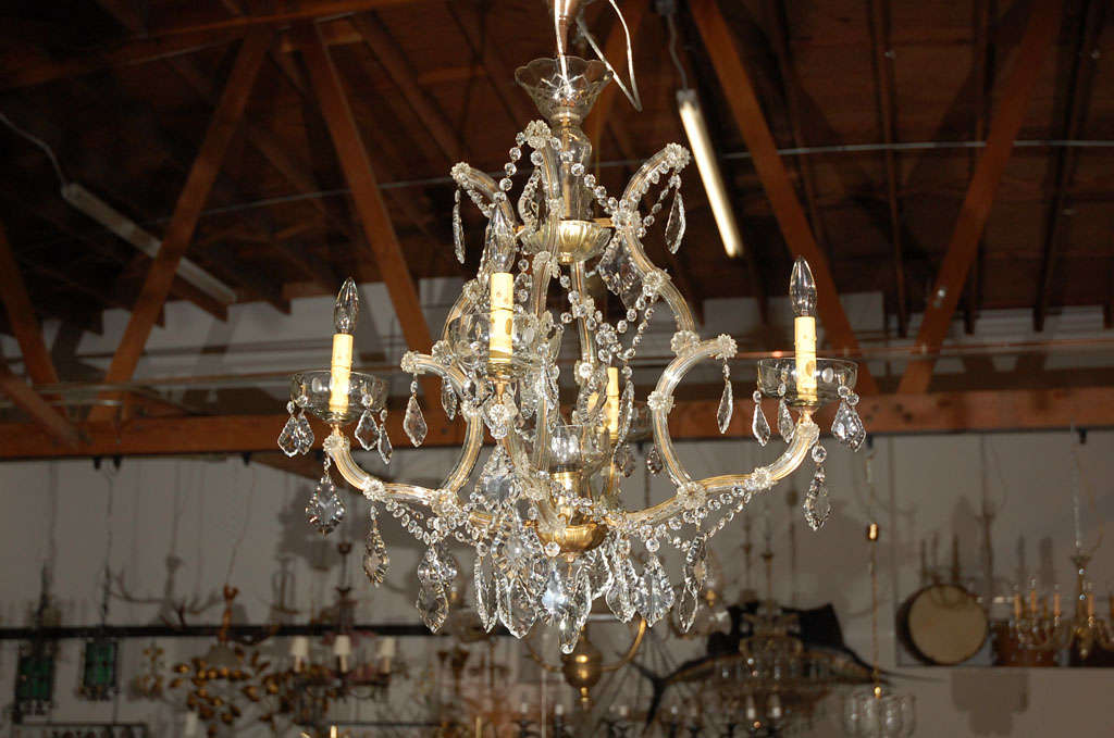 A graceful and appealing chandelier thought to be French or Italian, circa the 1930's. This quality lighting fixture could well be an asset to your next project. 