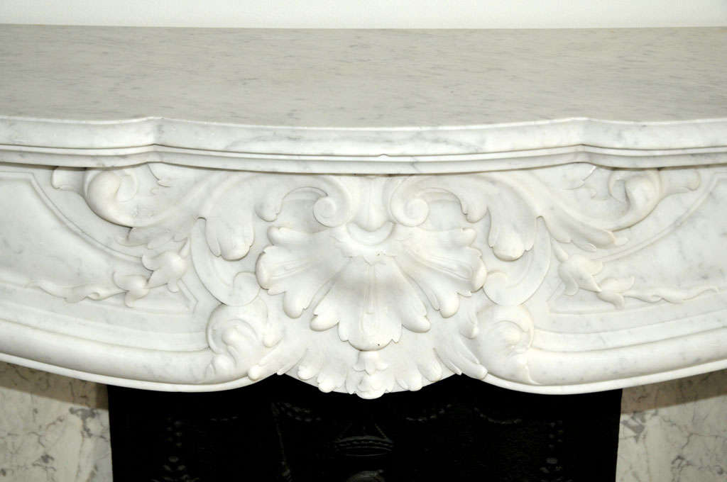 19th Century An early 19th century French Rococo Carrara marble fireplace / mantel piece
