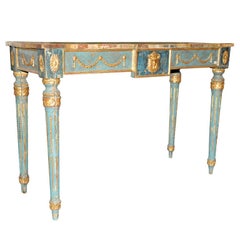 A decorative Italian Neoclassical painted console table with faux marble top