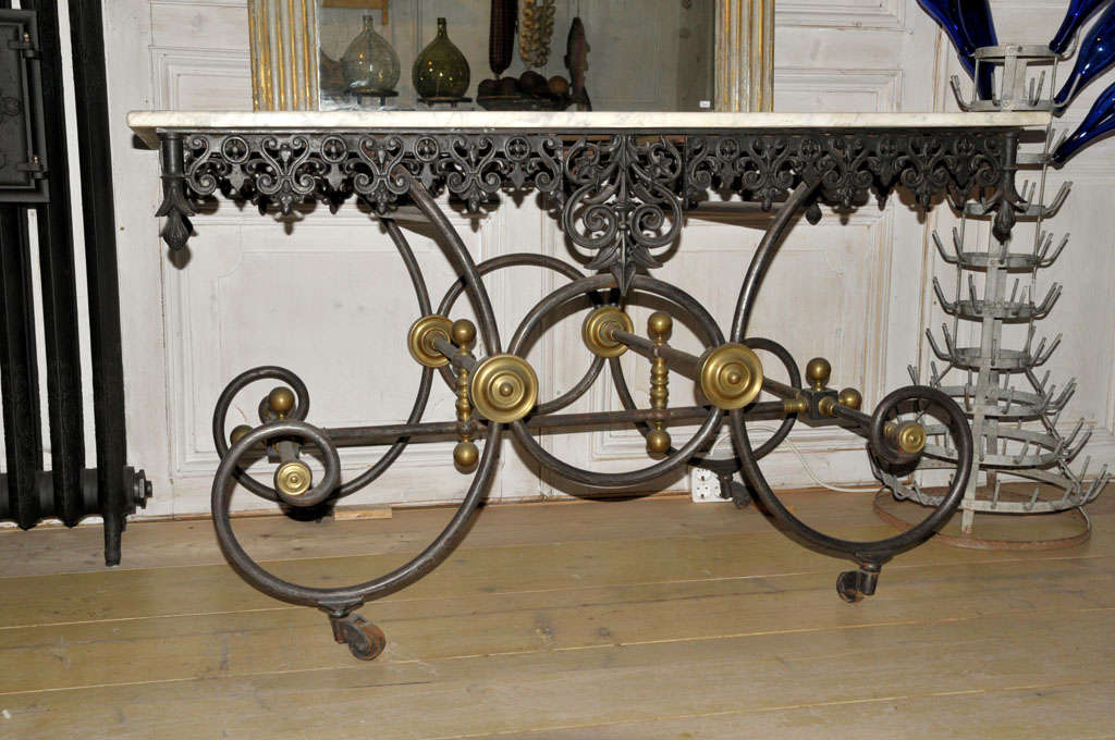 Late 19th century French butchers display table, with a Carrara marble top on a wrought and cast iron base