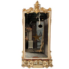 A monumental sized 19th century French carved giltwood mirror with planter