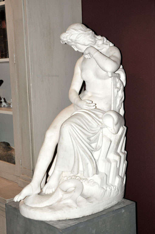 A carved statuario marble figure of a young bathing woman, 19th century