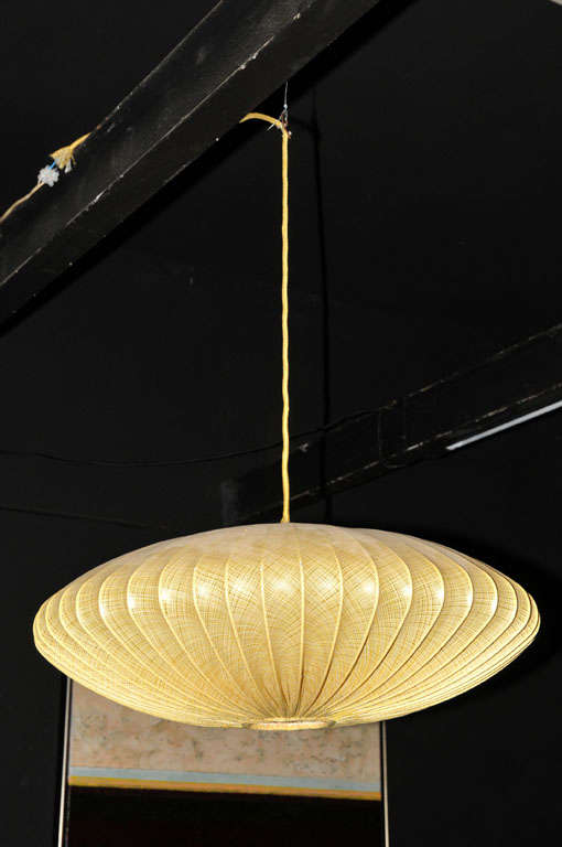 Rare beautiful pendant with shade tightly drawn over a steel frame hanging on his wire. One centered light source. Danish make from the 1950's