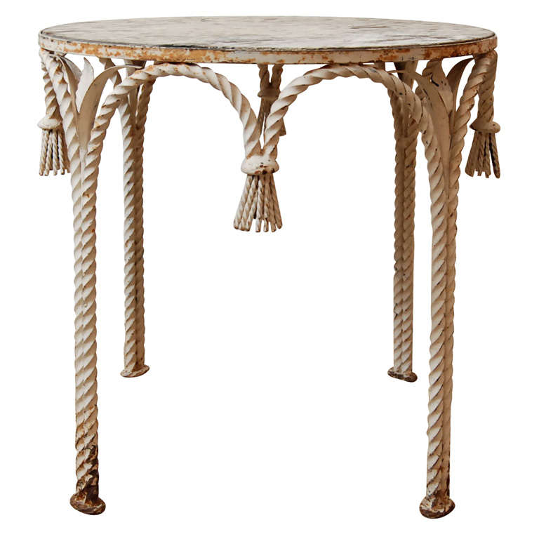 A Painted Iron Side Table with Tassels