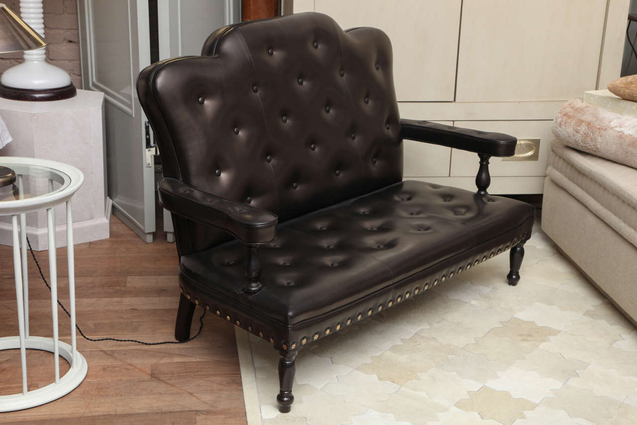 19th century Georgian style mahogany settee with original horsehair fill; upholstered in black plonge leather with updated tufting, faceted large nailhead trim and sable-finished turned stiles and legs