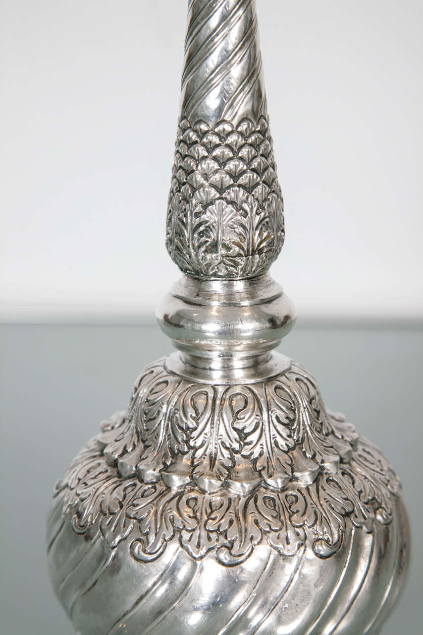 Repouse and carved silver sprinkler