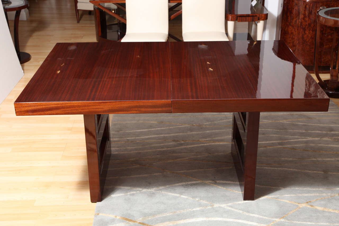 This Art Deco Dining Table is made of solid mahogany and mahogany veneer with 2 leaves. 

60”L x 40”D x 29”H- closed
90”L x 40”D x 29”H- open (each leaf 15”)