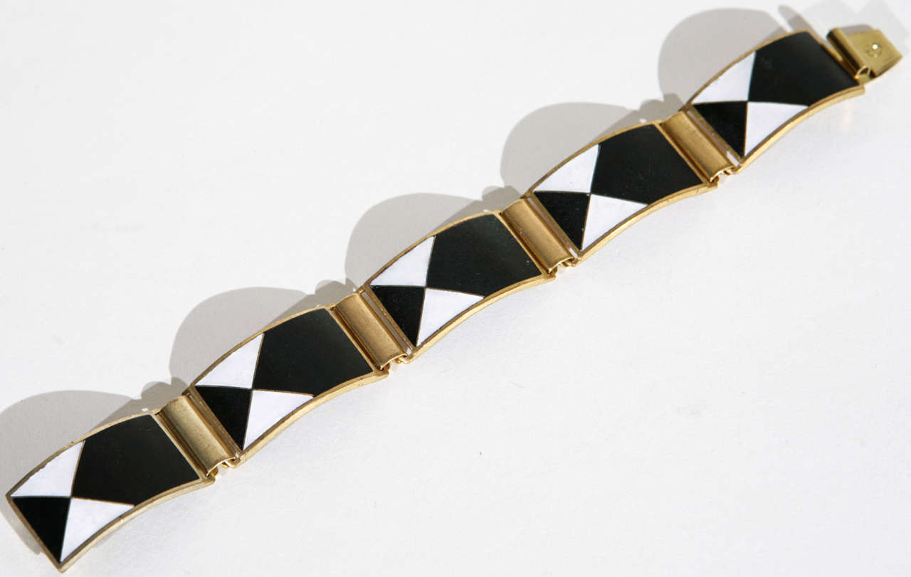 Five link matte enamel bracelet on brass in the Bauhaus style.  Very Handsome.Marked with the letter S in a circle.