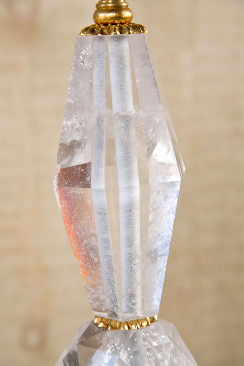 FACETED ROCK CRYSTAL , 8 SIDED GILDED WOOD BASE.
NOT WIRED, GILT METAL DECORATIVE  RINGS SEPARATE EACH SECTION OF ROCK CRYSTAL FROM THE NEXT.
Please feel free to contact us directly by using the  CONTACT DEALER  link on this page or by calling 