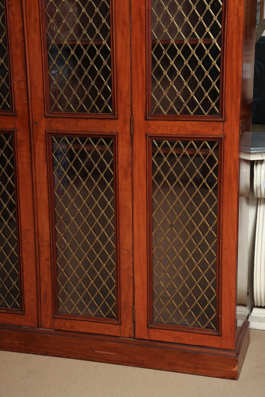 19th century Scottish, four glass door with grillwork bookcases, by John Taylor & Sons.