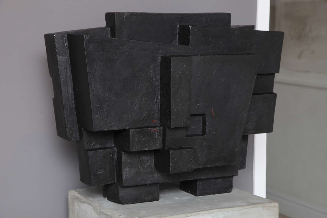 A Brutalist sculpture in the style of Parvine Curie. The sculpture is plaster covered in an encaustic black finish, it is believed to have been a study for a much larger bronze which can be seen on her web site.