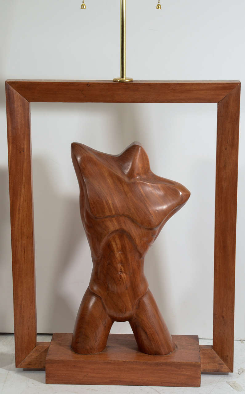 Abstract pair of hand-carved wood table lamps with figural torso motif; one male, one female, each one showcased in a Trapezoid Frame. Each one finished on both sides beautifully.
 