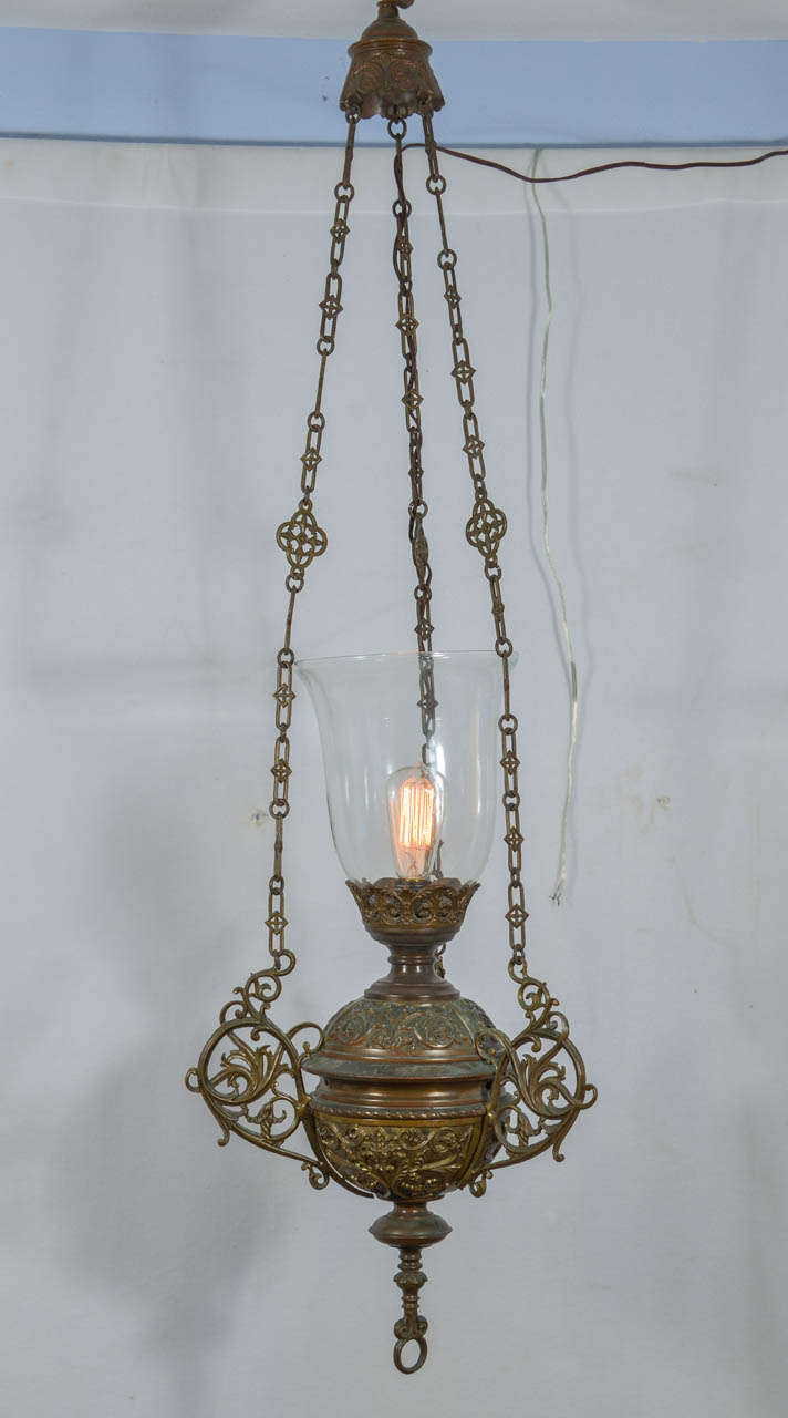 Beautiful cast bronze ceremonial lanterns, originally oil lamps, have been electrified.