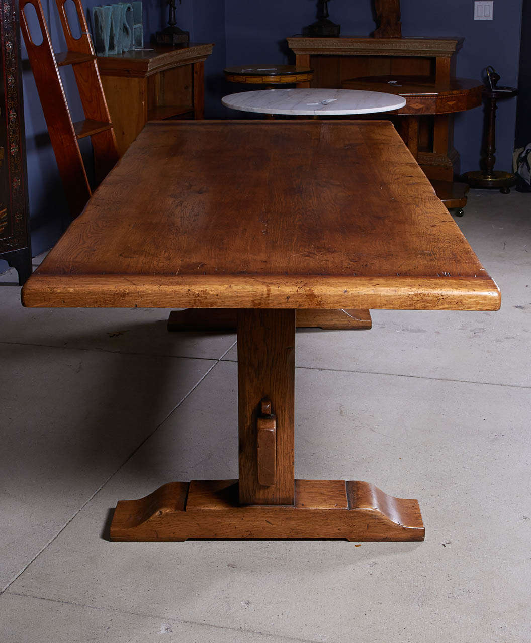 An Oak Dining Table with bread board ends and trestle supports.

Ask us about our reduced-rate shipping plans.