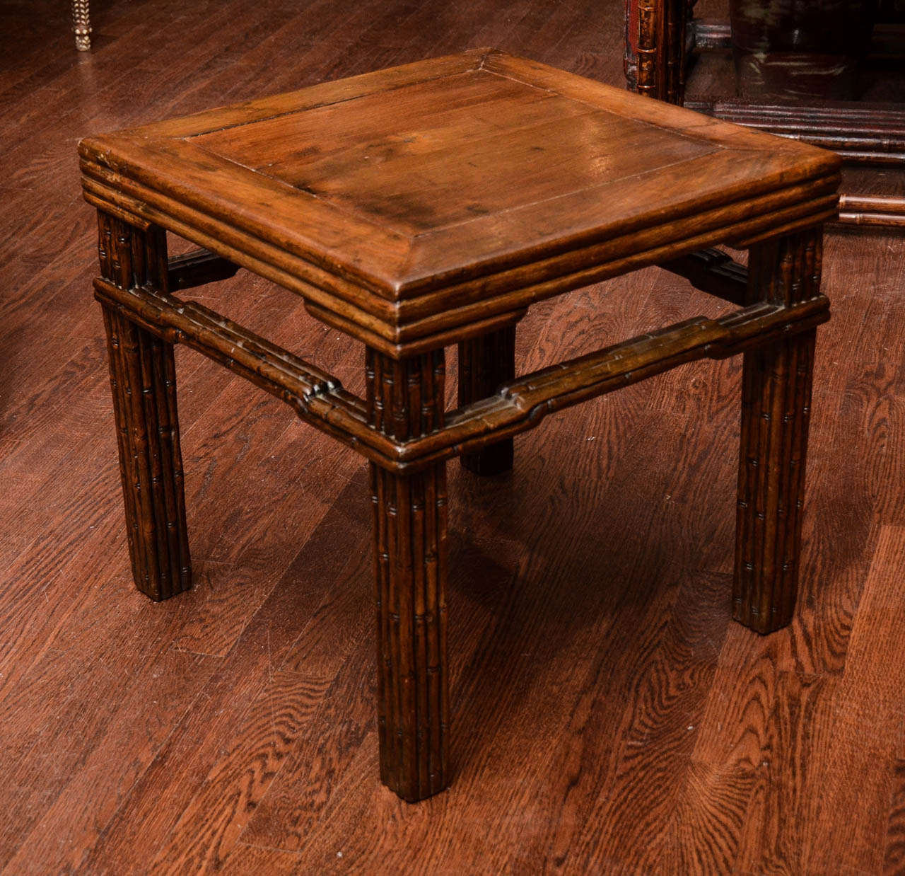 Turn of the century Qing dynasty faux bamboo carved stool with reeded decoration.