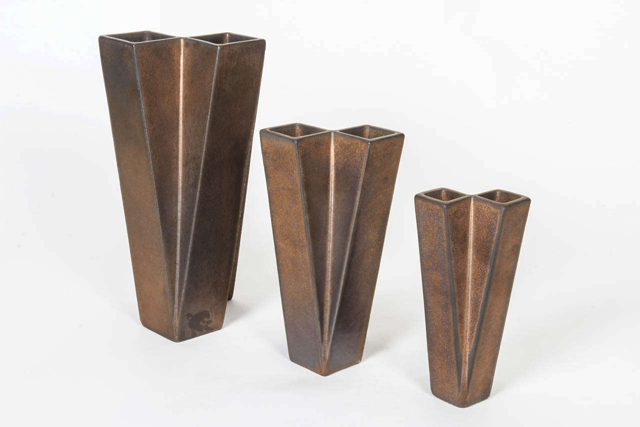 JAN VAN DER VAART  (1931-2000)  The Netherlands

Set of three squared tubular vases (3)  1979

Matte bronze glazed stoneware

Signed:  VD VAART  * 79  MAKKUM

Similar model illustrated: Jan van der Vaart Multipels 1967-1997, Allaard Hidding