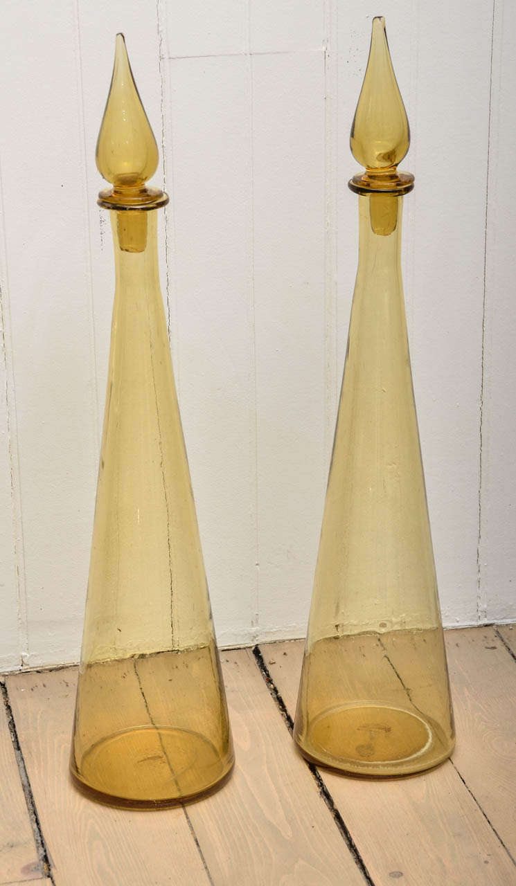 Pair of amber glass bottles with stoppers.