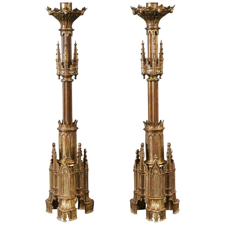 Pair of Gothic Style Candlesticks For Sale.