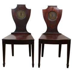 A Pair of George III Mahogany Hall Chairs