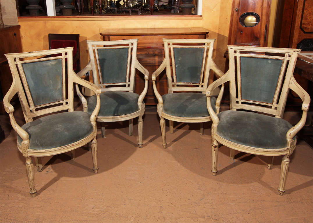 Set of Four French Directoire Style Arm Chairs

This is a wonderful set of four arm chairs with the Directoire style details: note the the pierced area around the backs and the square shape of the backs. It is also a great transitional piece as it