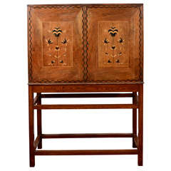 An English Arts and Crafts Walnut and Marquetry Inlaid Cabinet