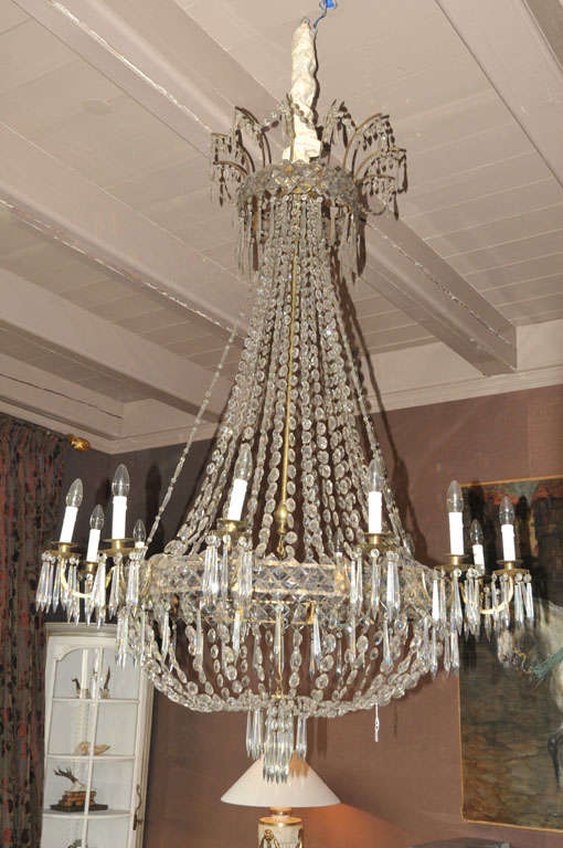 An impressive 19th century French Neoclassical (later) electrified brass and cut glass chandelier