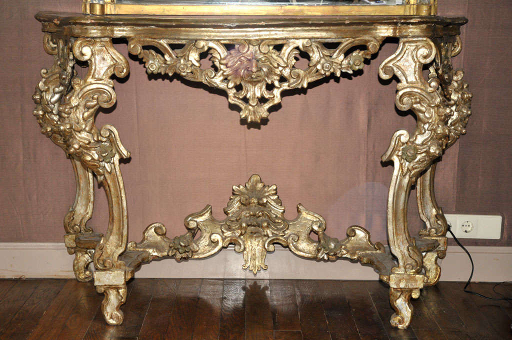 An 18th century French Regence carved silvered wood console table, circa 1720.