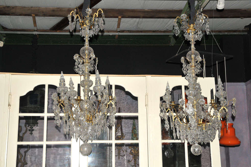 A pair of 18th century religious chandeliers, it's crystals depicting several religious symbols,adjusted for electricity in the beginning of the 20th century