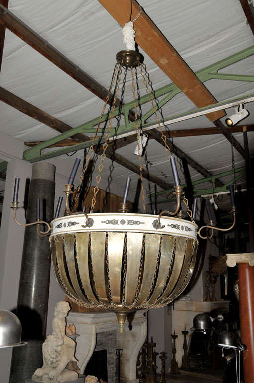 A large campaign wrought iron and cupper chandelier, Empire style