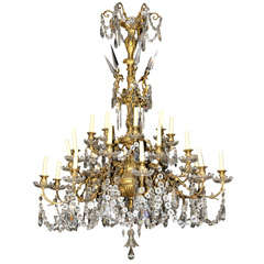 A large 19th century probably French electrified brass and cut glass chandelier