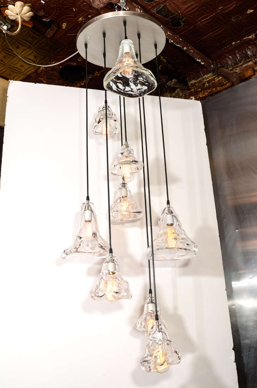 9 Hand blown glass lights. 
Original Design. Custom options available. Nine hand blown glass pendants are suspended from a circular nickel canopy. Great for entryways, stairwells. UL wired