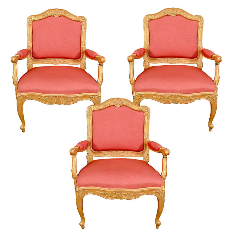 A Set Of Three Swedish Rococo Carved Giltwood Armchairs For Sale