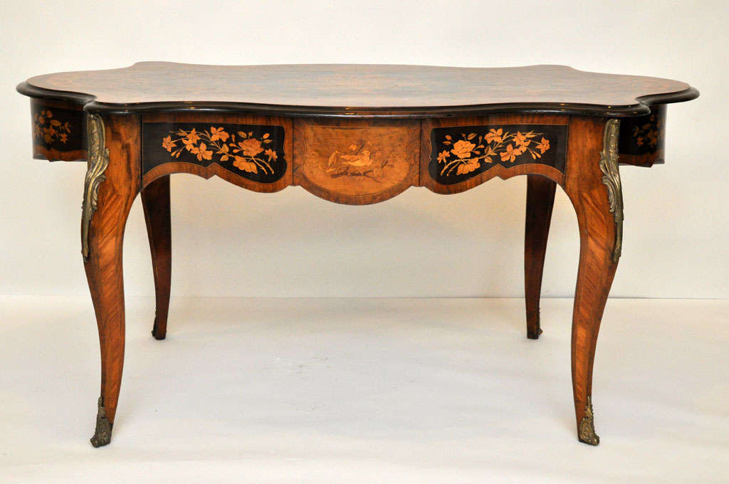Italian Ebonized Satinwood and Tulipwood Marquetry Center /Music Table or Desk. Shapely intricately detailed marquetry top surface depicting centered medallion flower bouquet admist ebonized background surrounded with birds, butterflies, foilage and