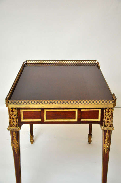 Gilt Neoclassical writing table after a model by Jean-Henri Riesener, France, 1860 For Sale