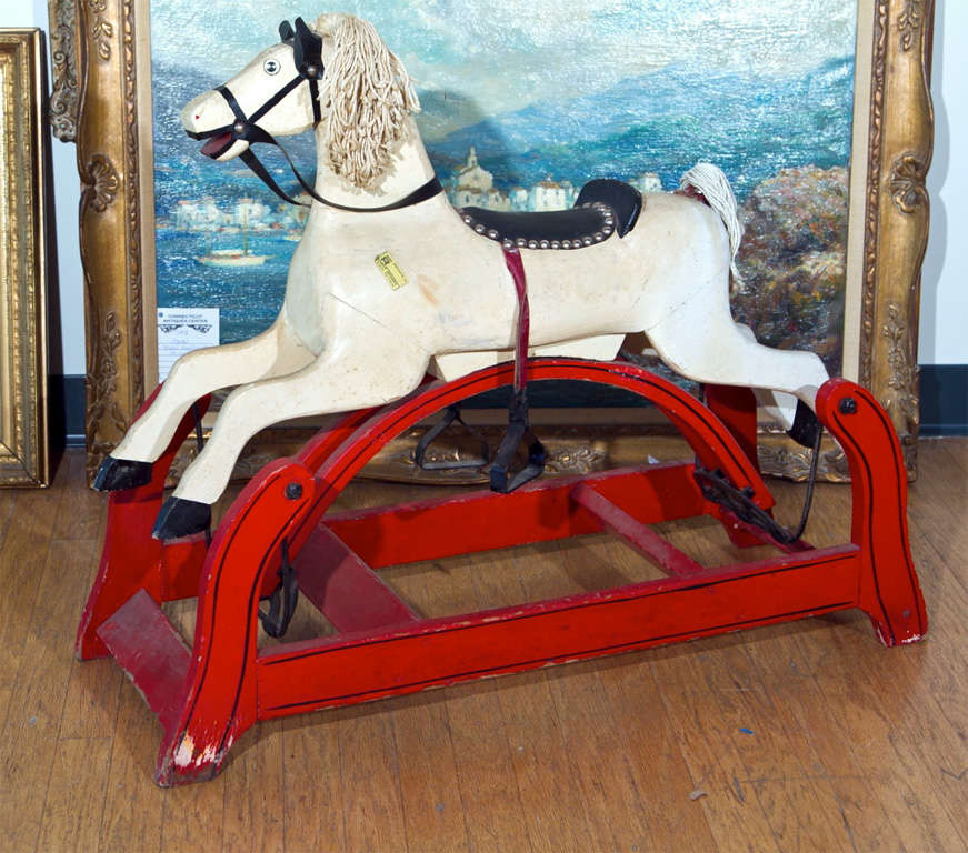 FOLKY EARLY 20TH CENTURY CHILD'S STATIONARY ROCKING HORSE
WITH ORIGINAL SADDLE  AND  REAL HAIR MANE- SOME TOUCH UP PAINTING
