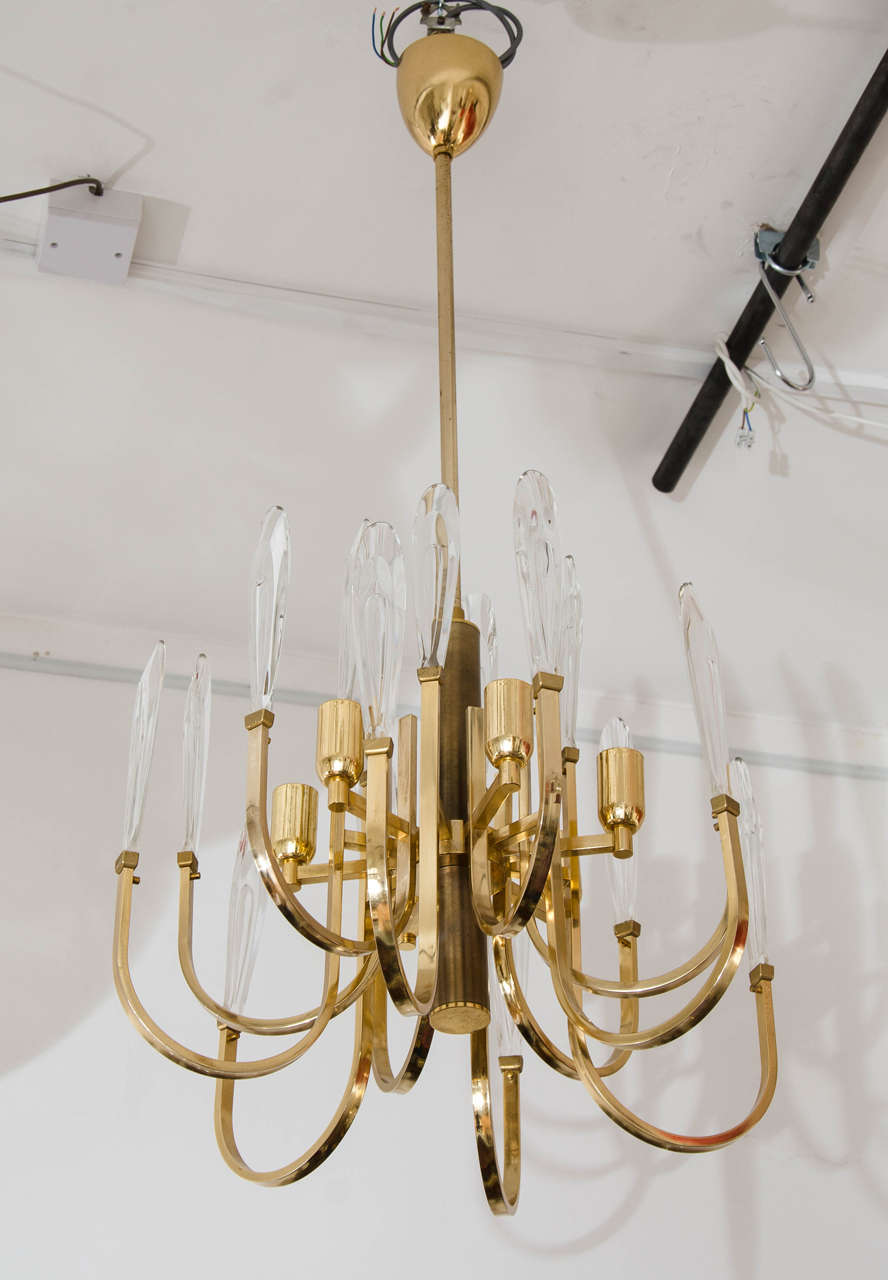 1970's Italian brass chandelier with thick clear glass.
Attributed to Sciolari.
