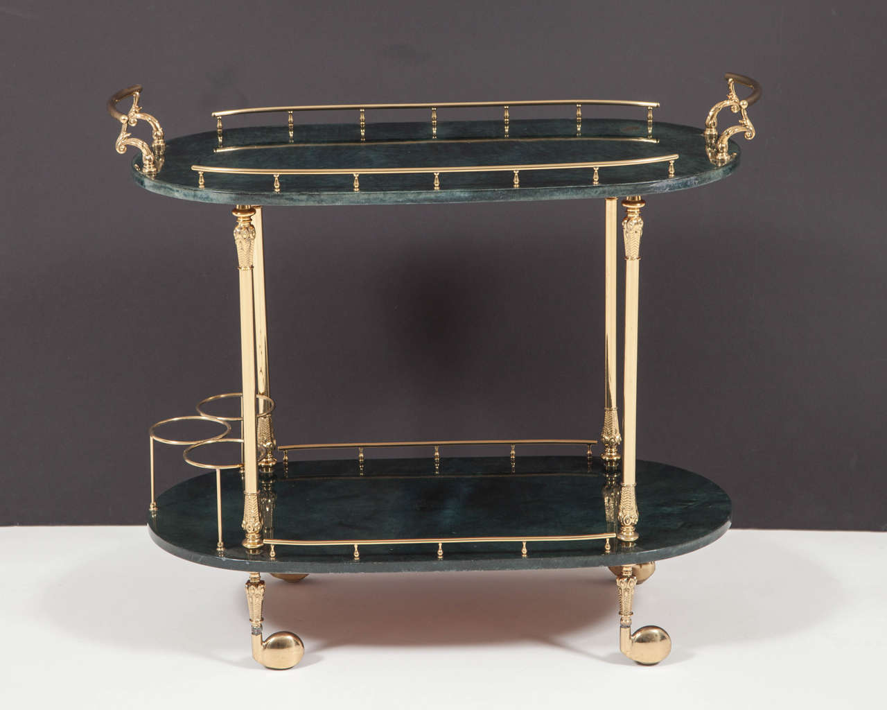 Mid Century lacquered goatskin bar cart in a deep blue/green color with gilt brass hardware.