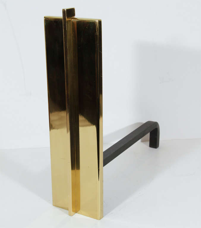 Pair of modernist brass andirons.  Each composed of a rectangular plate bisected vertically at center by a solid brass bar.