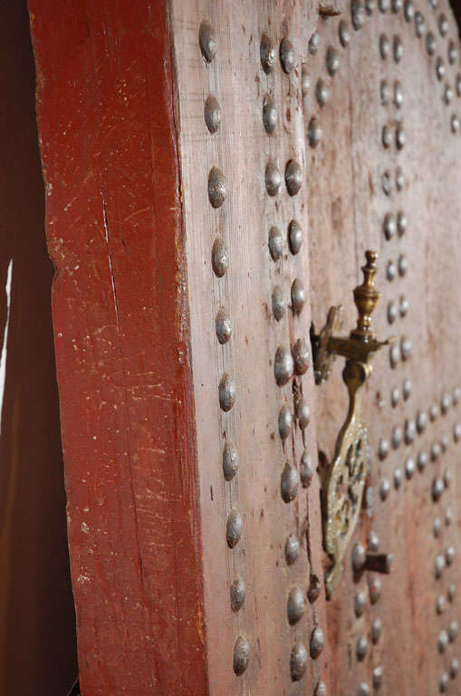 19th C. Large Moroccan Ryad Studded Moorish Antique Door In Distressed Condition For Sale In North Hollywood, CA