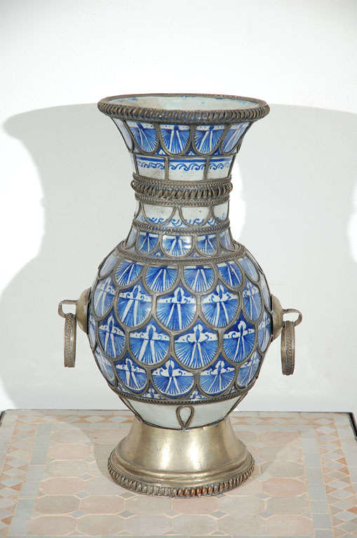 Incredible handcrafted ceramic Moorish style vase with fine filigree silver nickel work with handles.Antique Moroccan ceramic bleu de Fez vase.


Mosaik provides Antiques,Art Deco, Moorish Style, Spanish, African, Islamic Art, Arabian, Middle