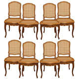 Set of Eight Walnut and Cane Dining Chairs