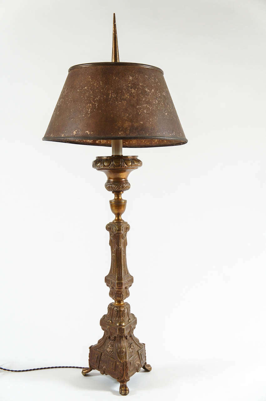 Last-half 19th-century Italian Baroque style repoussé brass table lamp of pricket stick form. Newly required for North American use; period mica shade for illustration only.
