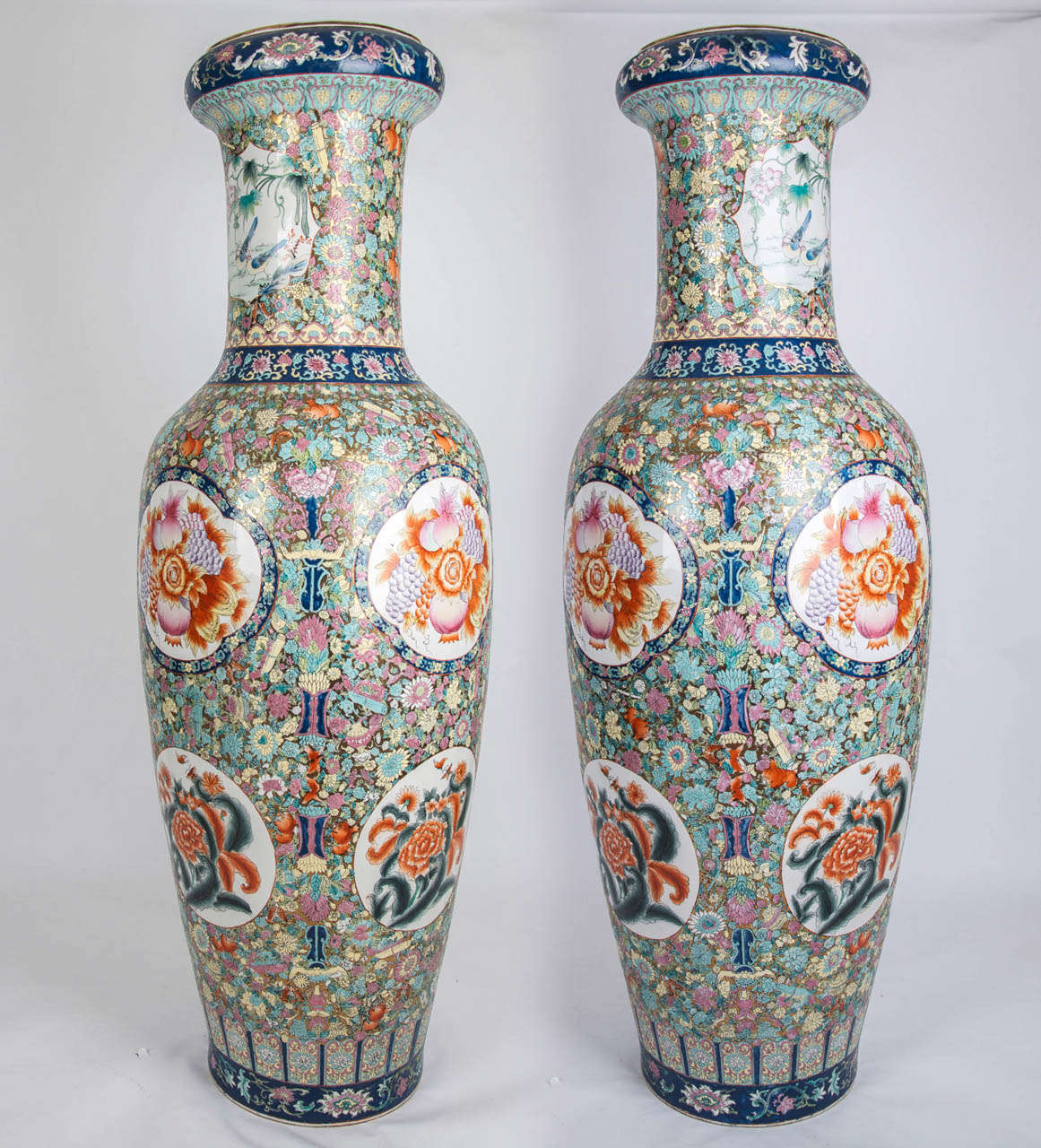 These are a VERY TALL and impressive PAIR of CHINESE Porcelain Palace or Floor Vases.

The vases have a baluster form with tall necks.

Each vase is similar but different in detail as they are hand enamelled. The  decoration is stunning with
