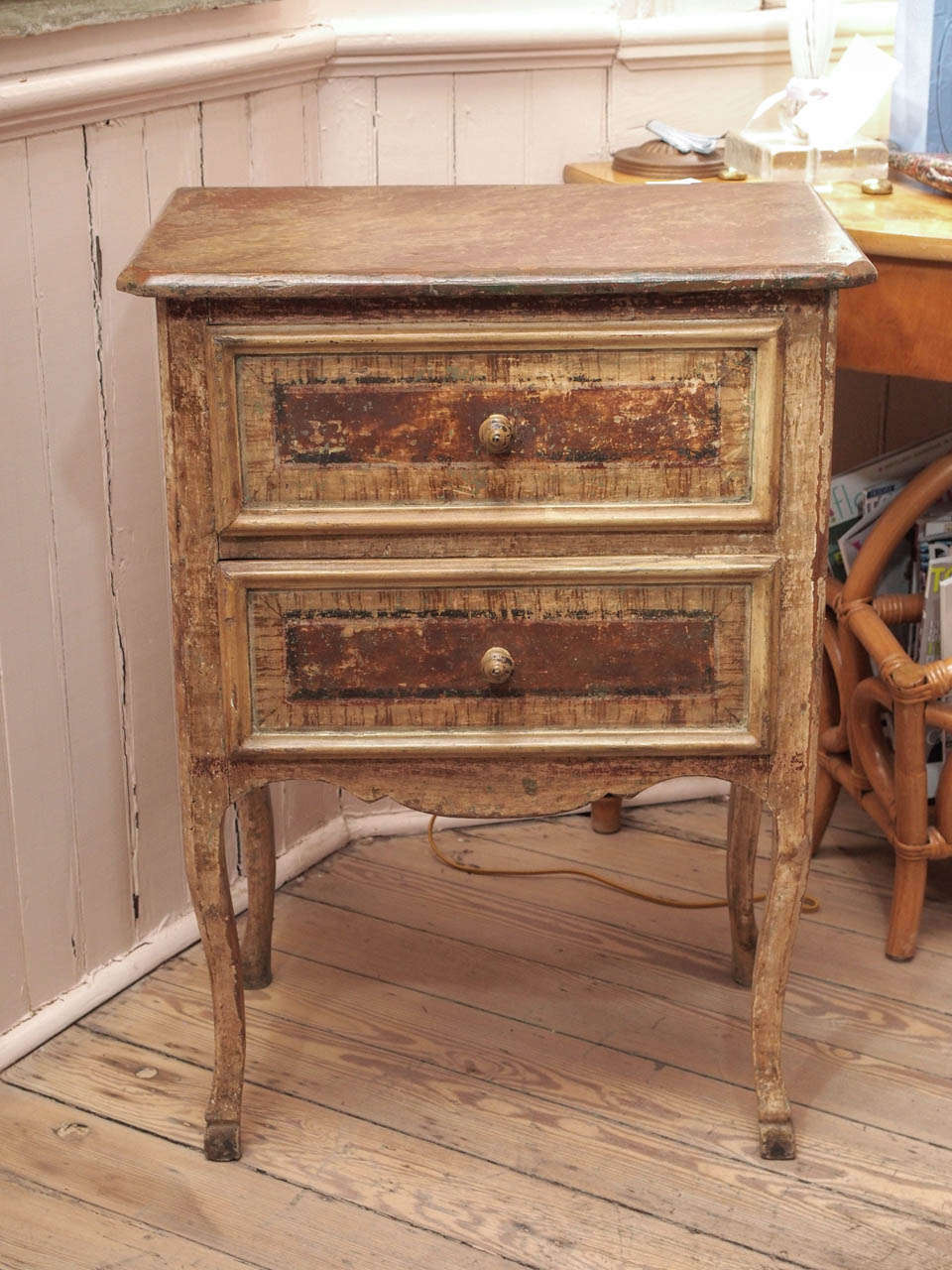 Charming 19th century painted two drawer commode with painted top with a marble like appearance and cabriole legs.