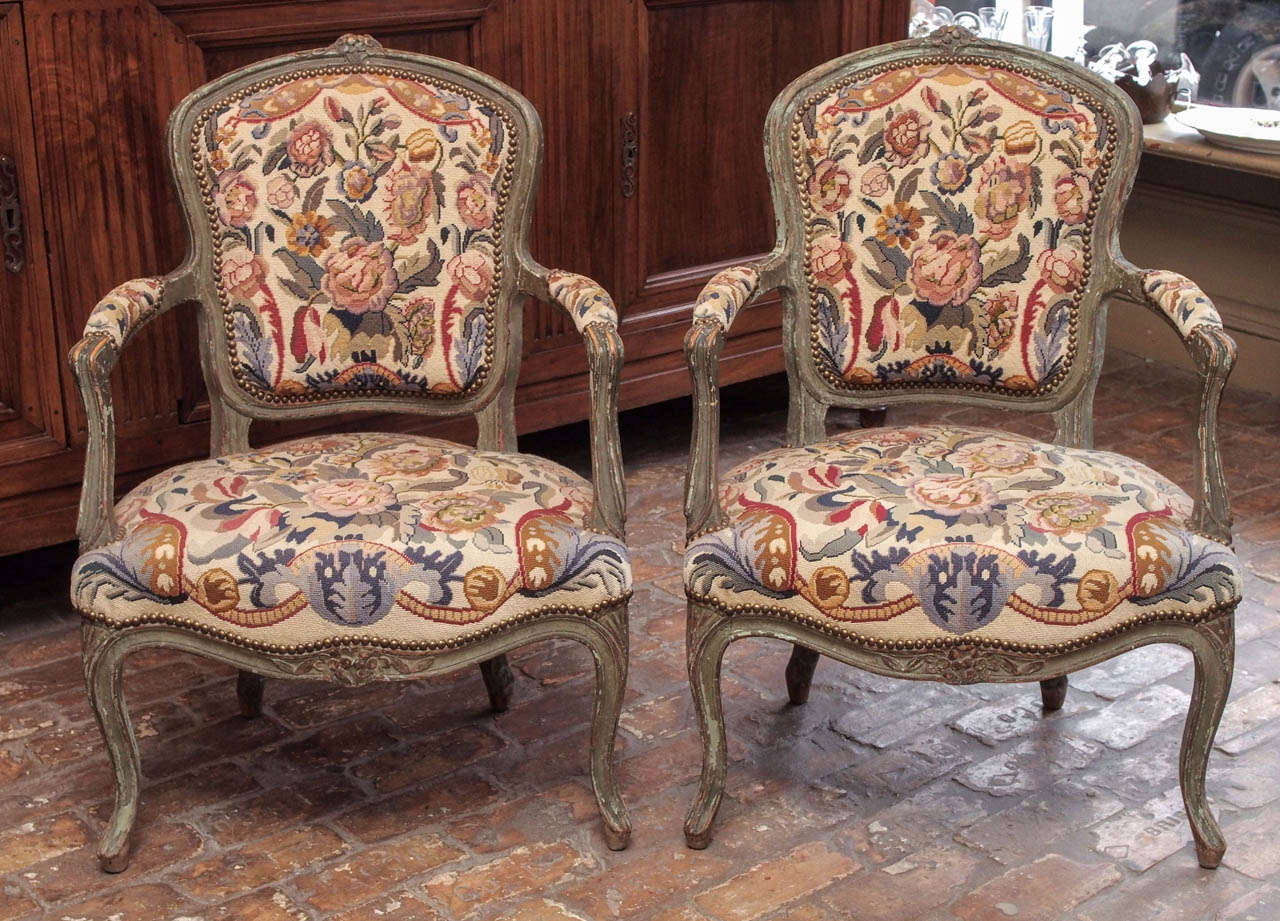 Pair of late 18th century French Louis XVI period painted fauteuils, circa 1780, with later tapestry upholstery.
