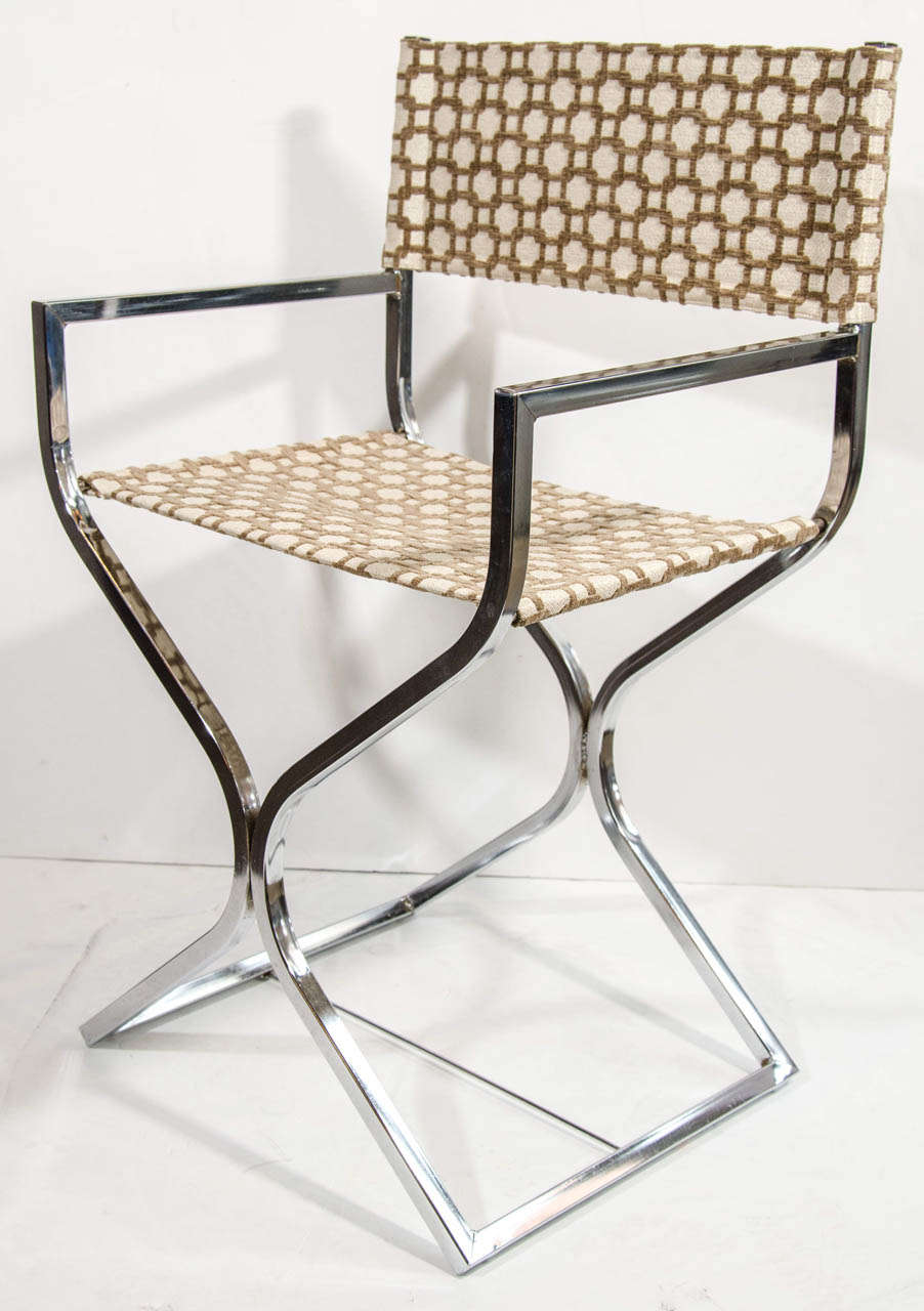 Mid century modern director's chair in chrome with stylized hourglass base and leg design. The chair has been newly upholstered in a geometric printed chenille over metallic ivory fabric. Makes an excellent desk or writing table chair.